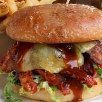 Angus Prime Bacon Cheddar Burger · USDA Prime burger patty, thick cut bacon, white cheddar, DCG secret sauce, house fries.
