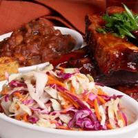 St. Louis Style Pork Ribs · Dry rubbed, meaty ribs, smoked “low and slow”, BBQ sauce. Served with coleslaw, cornbread, a...
