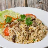 Roasted Duck Fried Rice · Fried rice with roasted duck, egg, white onions, green onions, topped with tomatoes, cilantr...