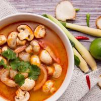 Tom Yum Goong (Shrimp)  · Thai style hot and sour soup with shrimp, mushroom, tomatoes, galangal and lemongrass.