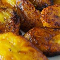 Maduros Plantain · Sweet ripe fried plantains with cotija cheese on top.