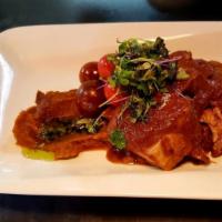 Puerco a lo Lento · Sous Vide Pork loin in a delicious passion fruit sauce over a refined sweet plantain puree &...
