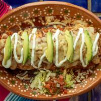 Wet Regular Burrito · Your choice of meat, rice, and beans.  topped with our red mole sauce. (Our red mole sauce c...