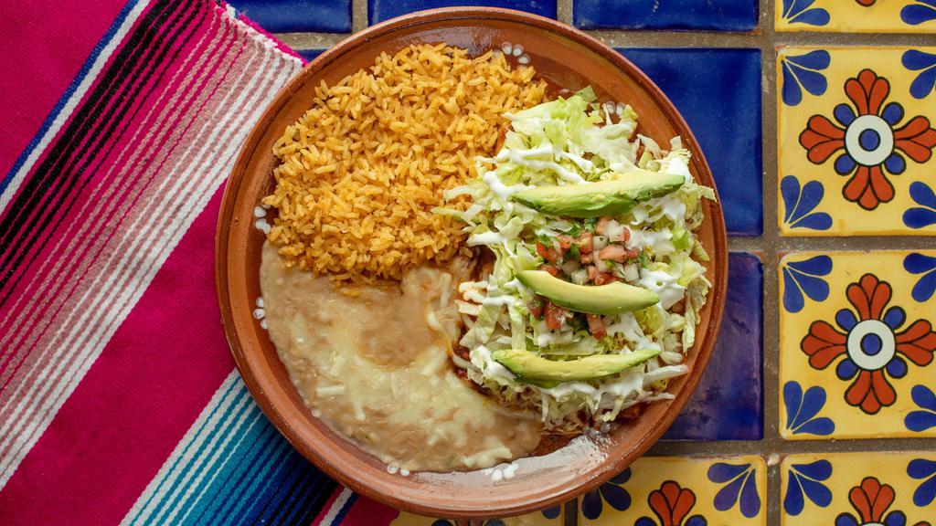 Cheese Enchiladas · 2 cheese enchiladas, topped with red or green salsa, alongside beans and rice. (Our red mole sauce contains peanuts).