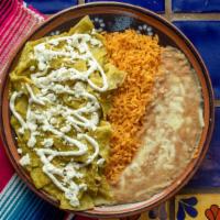 Regular Chilaquiles  · Fried tortilla chips, topped with red or green salsa, cheese alongside beans and rice. (Our ...