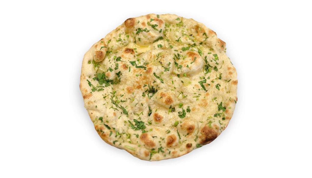Garlic Naan · Leavened flour dough flattened, topped with chopped garlic and baked in clay oven.