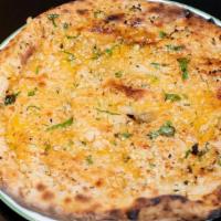 Garlic Cheese Naan · Garlic naan stuffed with cheese, then baked in clay oven.