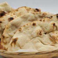 Tandoori Roti · Unleavened whole wheat bread cooked in tandoori.