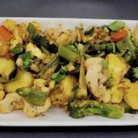 Tossed Veggies · Steamed vegetables tossed in tawa with garlic and seasoning.