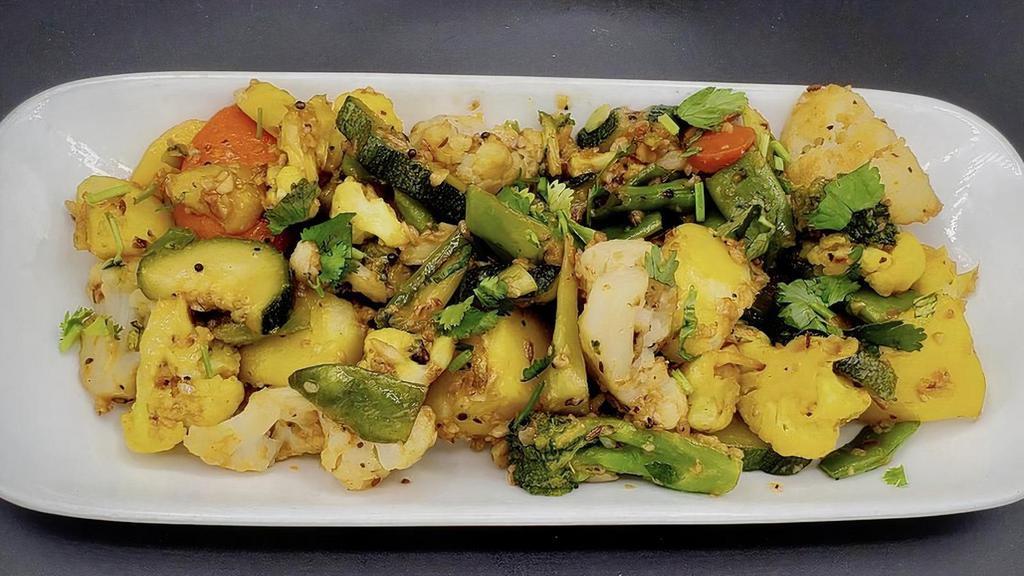 Tossed Veggies · Steamed vegetables tossed in tawa with garlic and seasoning.