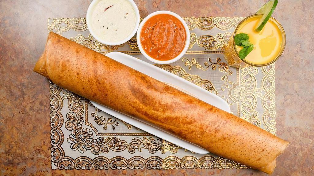 Dosa - Chili Dosa · Vegetarian. South Indian crepe delicacy made with rice flour and lentil batter.