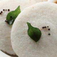 Idly · Vegetarian. Steamed rice and lentil cake accompanied with sambar, and chutneys served steami...