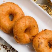 Medhu Vada · Vegetarian. Deep-friedd lentil donuts, fried golden brown, served with sambar and chutneys.