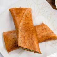 Paneer Spring Dosa · Dosa stuffed with minced paneer rolled and cut into pieces.