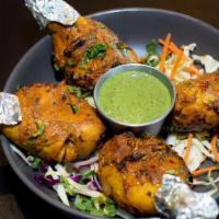 Tangri Kabab · Chicken leg piece is marinated in yogurt, ginger, garlic, and spices cooked in tandoori.