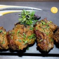 Desi Lamb Chops · Lamb chops marinated in special Koriander masala, roasted in the clay oven, and served sizzl...