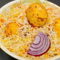 Egg Biryani · Boiled and peeled eggs cooked in a sauce flavored with special spices and mixed with flavore...