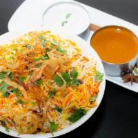 Butter Chicken Biryani - 1/4 Tray · Tandoori chicken pulled off the bone, sliced, and cooked in a sauce flavored with special sp...