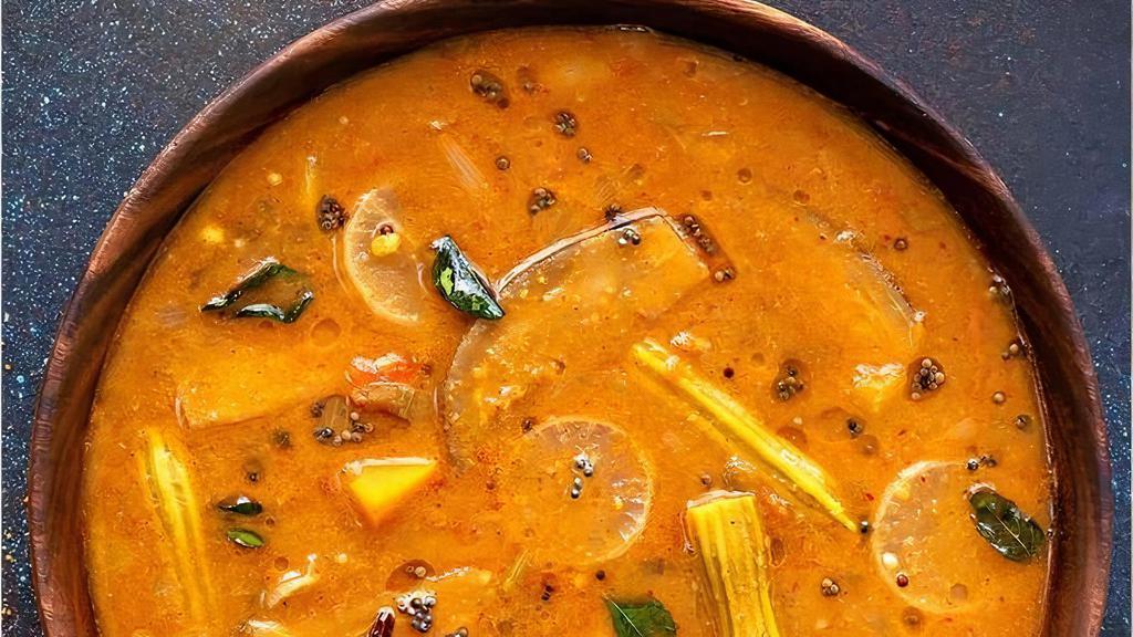Sambar - 16 oz · A yellow lentil-bashed vegetable stew, cooked with tamarind broth, and seasoned with Indian spices and curry leaves.