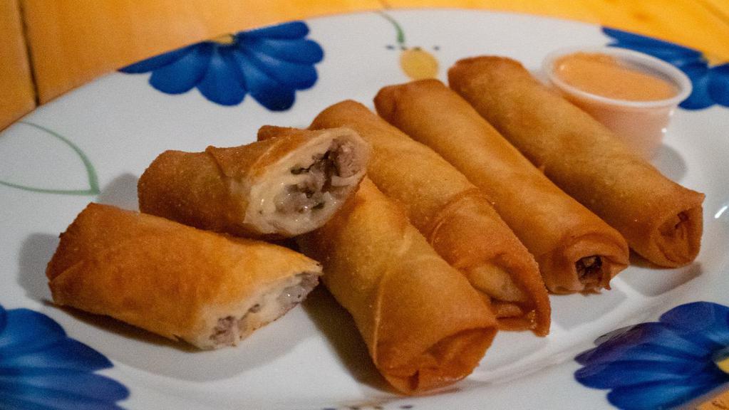 Cheese Lumpia (5) · Fried lumpia stuffed with Swiss cheese, beef, garlic, celery, bean sprouts and green onion. Served with house spicy peanut sauce. Made in-house daily. Five per order.