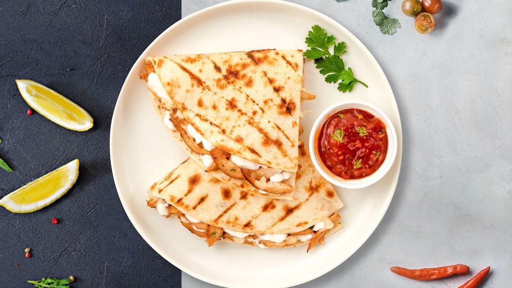 Veggie Victory Quesadilla · Mushrooms, pumpkin, zuchini, spinach, red bell pepper and onions wrapped with mozzarella cheese in a grilled tortilla