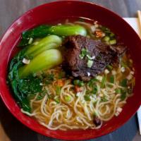 Soy Braised Short Rib Noodle Soup · Savory light broth with noodles.
