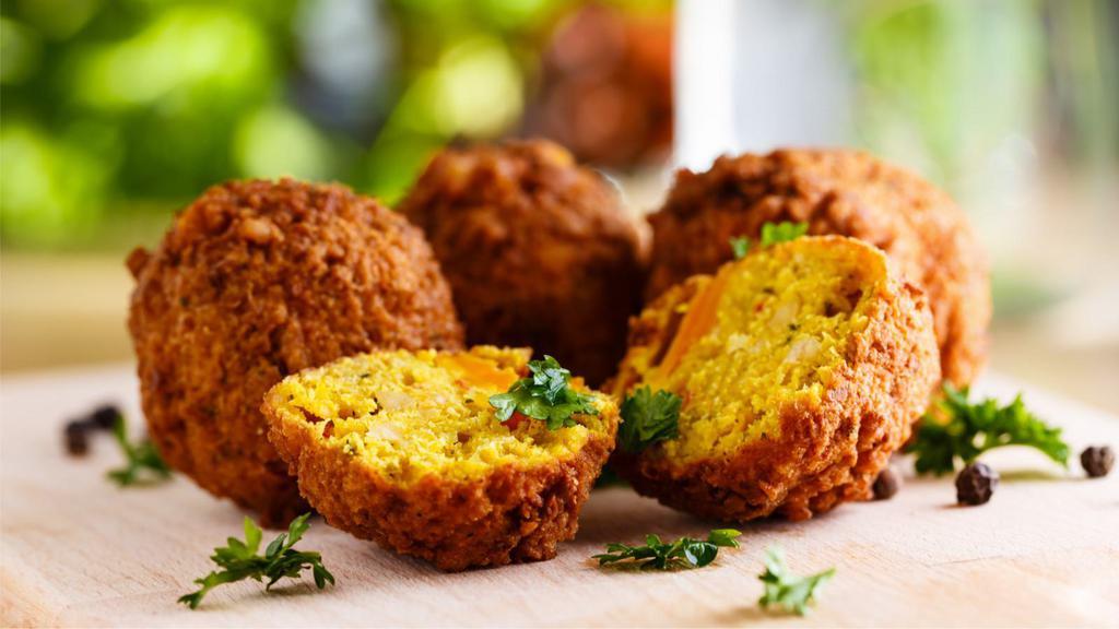 Falafel · 7 pieces fine ground chickpeas with vegetables and seasoning.