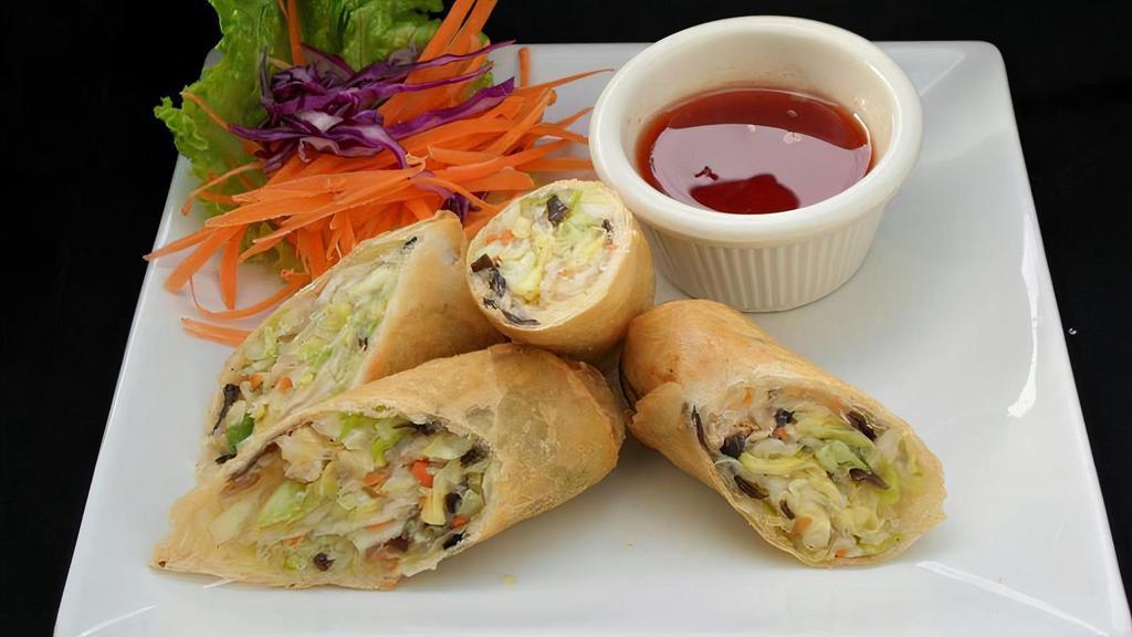 #2. Por Pia Tod (Egg Rolls - 2 Rolls) · Chicken, cabbage, bean noodles wrapped in egg roll skin. And deep fried. (available in vegetarian).