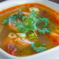 #10. Large Tom Yum · Spicy and sour soup with mushrooms, lemongrass, tomato, lime juice and cilantro.