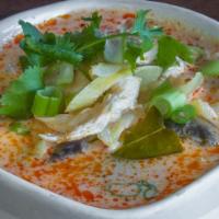 #11. Large Tom Kha · Spicy and sour soup with coconut milk, cabbage, galanga, mushrooms, lemongrass and lime juice.