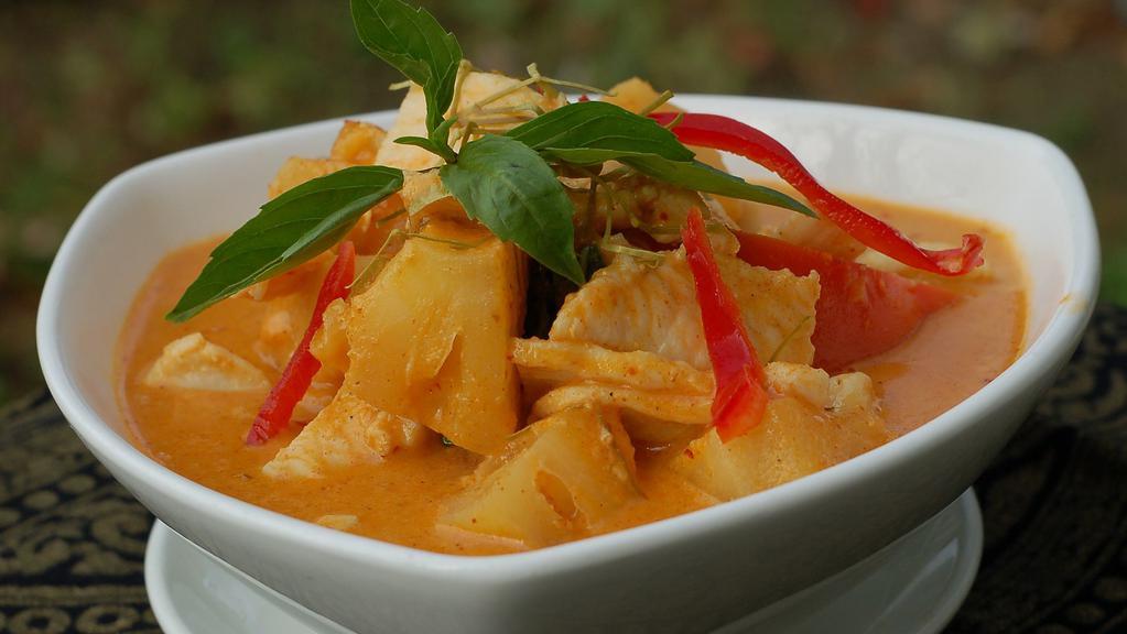 #47. Gang Sub Pa Rod · Red curry with pineapple, bell pepper, basil and coconut milk.