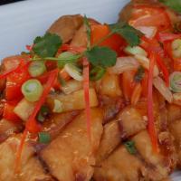 #57. Pla Sam Road · Deep-fried fish topped with spicy sweet and sour sauce.
