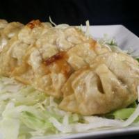 Gyoza · Deep Fried Pot Stickers filled with Beef, Pork, and Vegetables. (6pc)