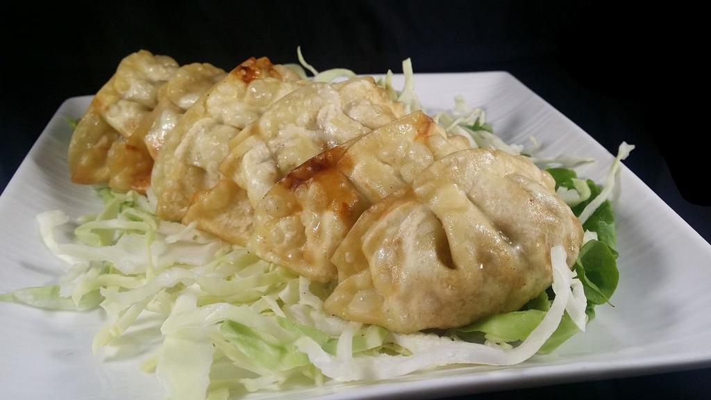 Gyoza · Deep Fried Pot Stickers filled with Beef, Pork, and Vegetables. (6pc)