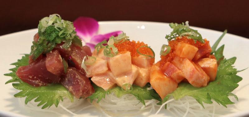 Poke Trio · Hamachi, salmon, tuna with salad and special sauce.