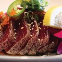 Sea Steak · Thin pepper slice tuna with jalapeño, garlic-yuzu ponzu and green onion.