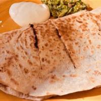 Veggie Quesadilla · A 14” flour tortilla filled with melted cheese, topped with sour cream and guacamole.