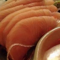 Hamachi (Yellowtail) Sashimi · Sliced raw Yellowtail fish served with daikon radish.