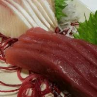 Maguro (Tuna) Sashimi · Sliced raw Tuna served with daikon radish.