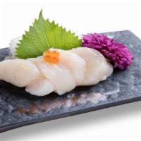 Albacore (White Tuna) Sashimi · Sliced raw White Tuna served with daikon radish.
