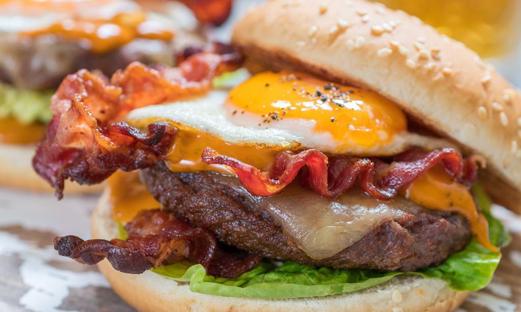 Morning Dew Burger · 1/2 lb. Niman Ranch beef, topped with fried egg, apple wood bacon, Cheddar cheese, lettuce, tomato, onion and chipotle mayo.