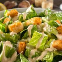 Caesar Salad · Romaine lettuce tossed with Parmesan cheese, seasoned croutons and Caesar dressing.