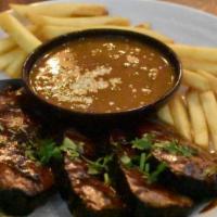 Chipotle BBQ Tri Tip · Thick sliced, flame-broiled tri-tip with chipotle bar-b-que glaze. Served with fries and hou...