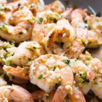 Mojo De Ajo Shrimp · Prawns and mushrooms sautéed in a roasted-garlic butter and white wine sauce. Served with be...
