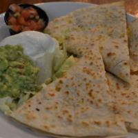 Quesadilla · Melted cheese in an oversized flour tortilla. Served with pico de gallo, Mexican crema and g...