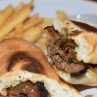 Tri Tip Sandwich · Tri-tip seared over an open fire, sliced thin and topped with caramelized onions on a fresh ...
