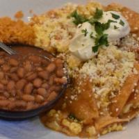 Chilaquiles Breakfast · Crispy corn tortilla chips and scrambled eggs in guajillo and ranchera salsas, with Mexican ...