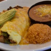 Guanajuato Omelet · Shredded chicken and home fries, topped with guajillo enchilada sauce, shredded cheese, and ...