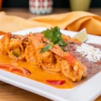 CAMARONES a la CHIPOTLE · Sauteed jumbo prawns with ref onions mixed bell peppers served with asteca rise, beans toppe...
