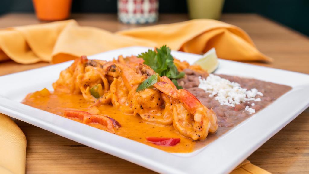 CAMARONES a la CHIPOTLE · Sauteed jumbo prawns with ref onions mixed bell peppers served with asteca rise, beans topped with Vizcaina Sauce